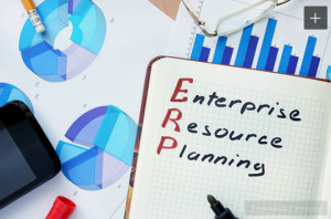 Three key drivers for changing your ERP platform - notepad with enterprise resource planning written in ink and printed graphs