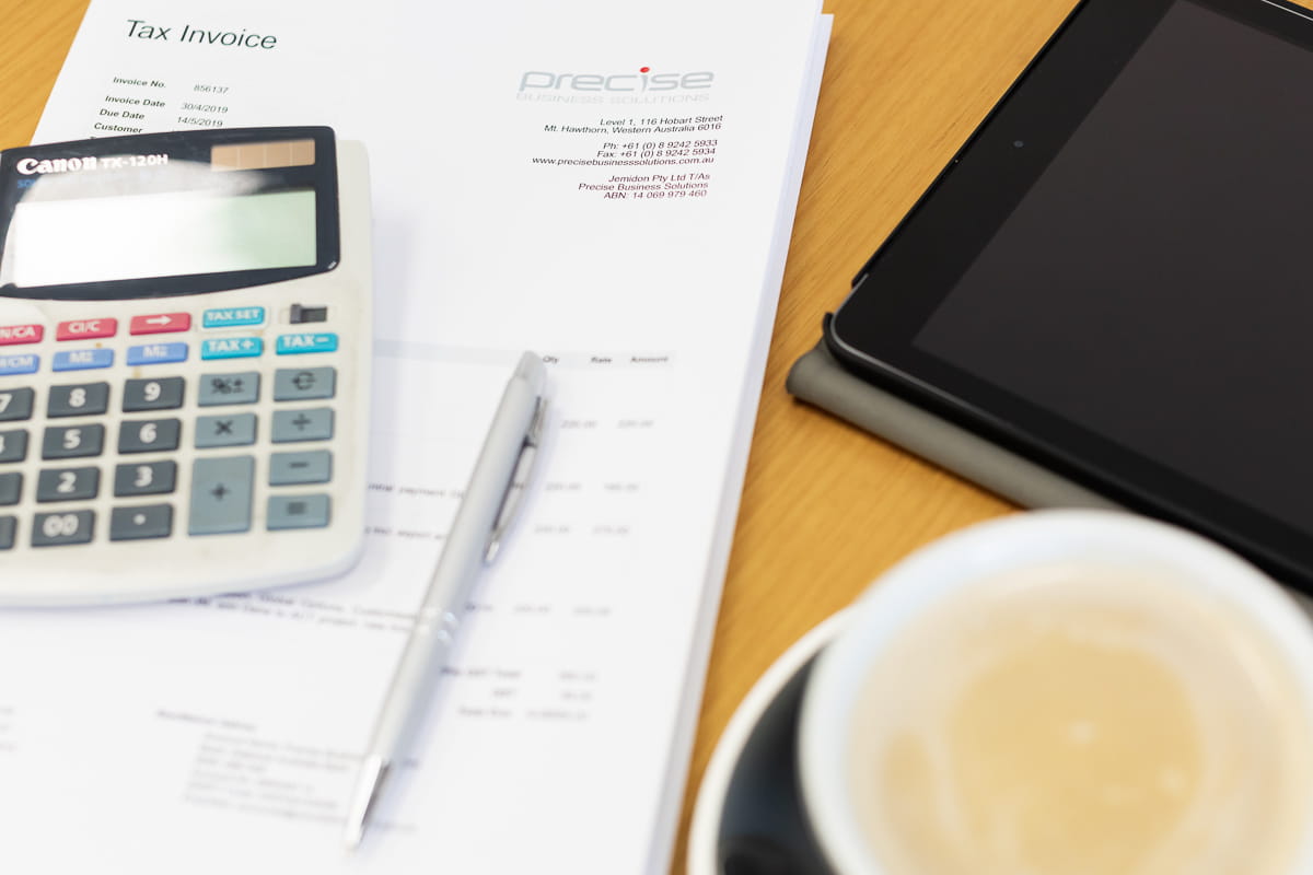 Precise branded invoice with coffee, tablet and calculator