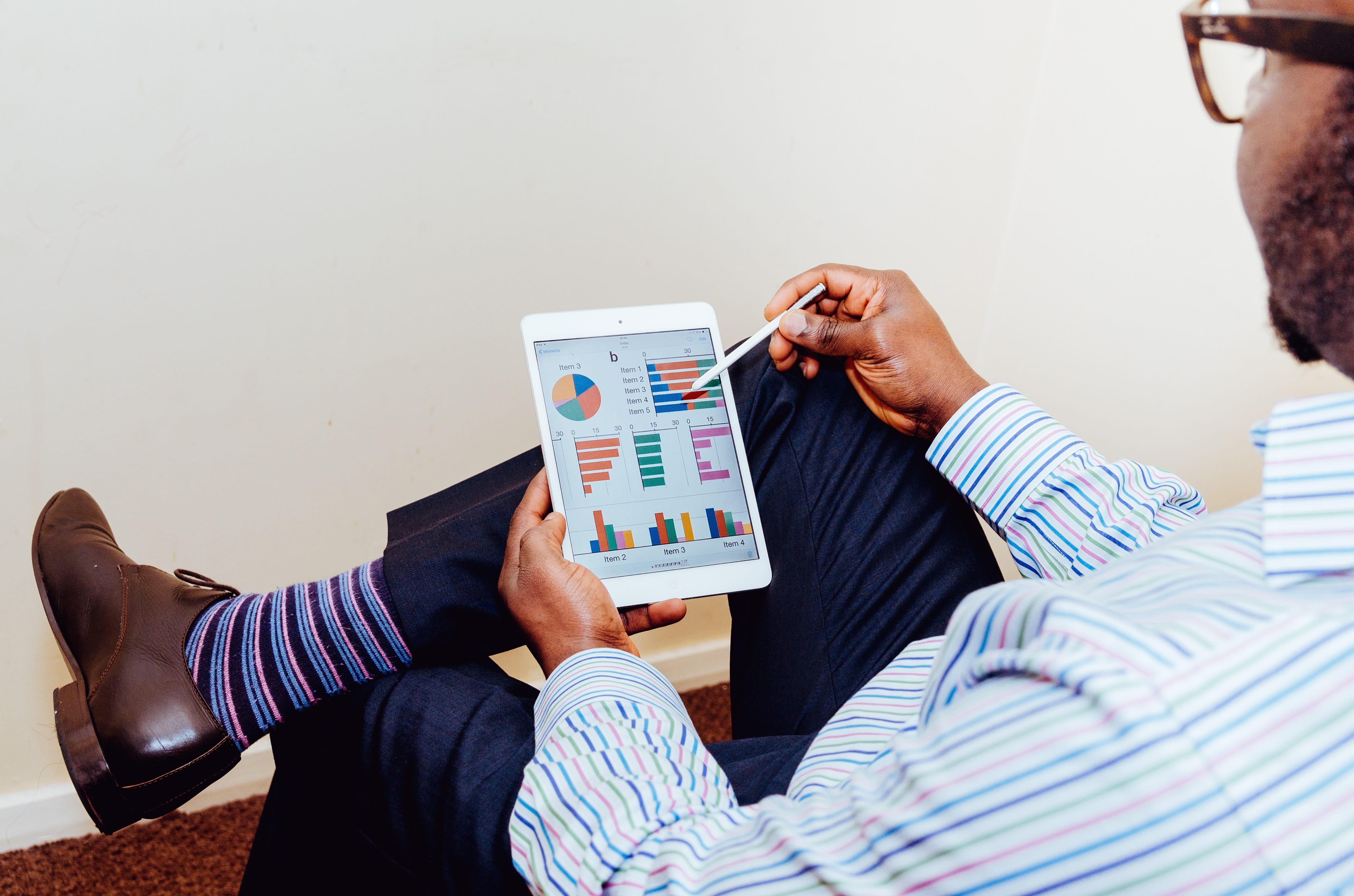 Businessman accessing reports and data from his mobile device