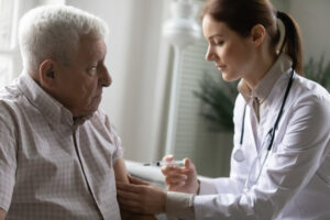 older man receiving a vaccination