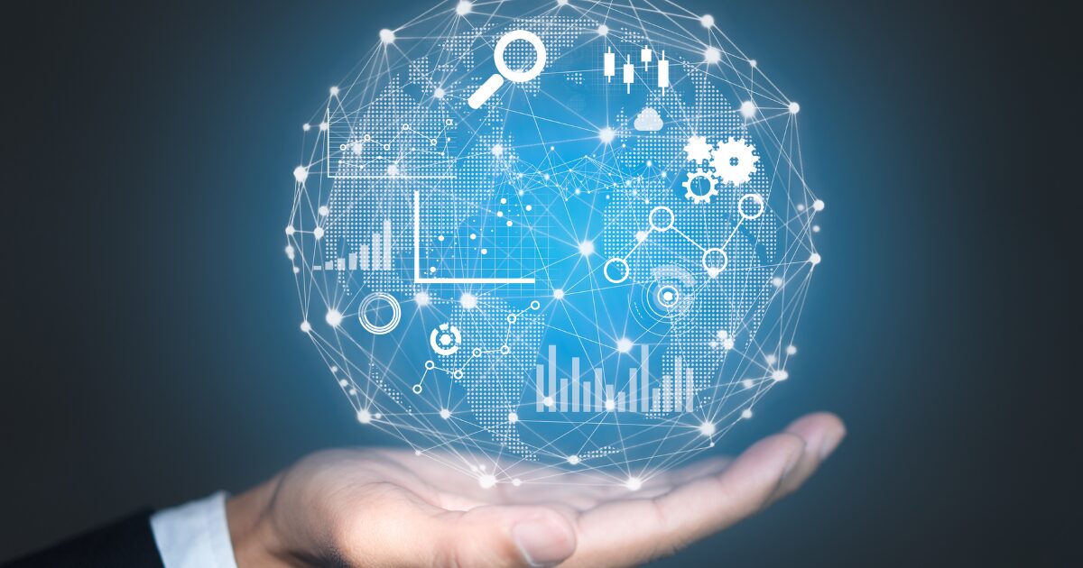 A hand holding a digital globe with interconnected data graphs and analytics, symbolising ERP for global business management.
